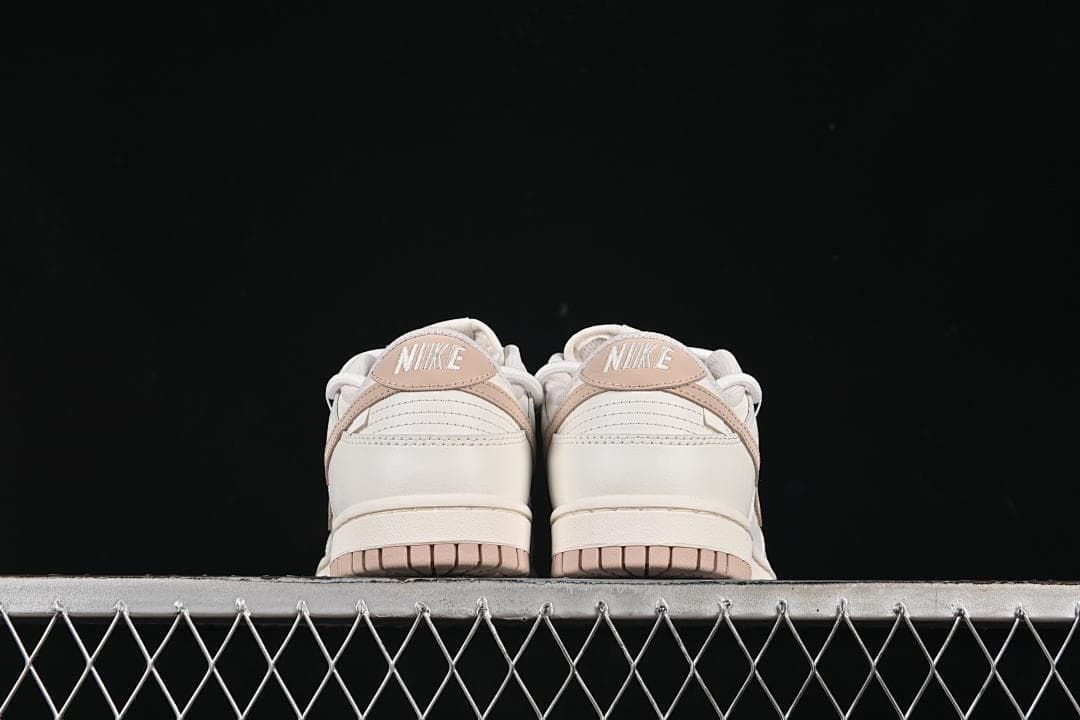 Nike SB Dunk Low Sneakers in White and Soft Pink