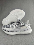 Yeezy 350 V2 Knit Sneakers in Black and White
