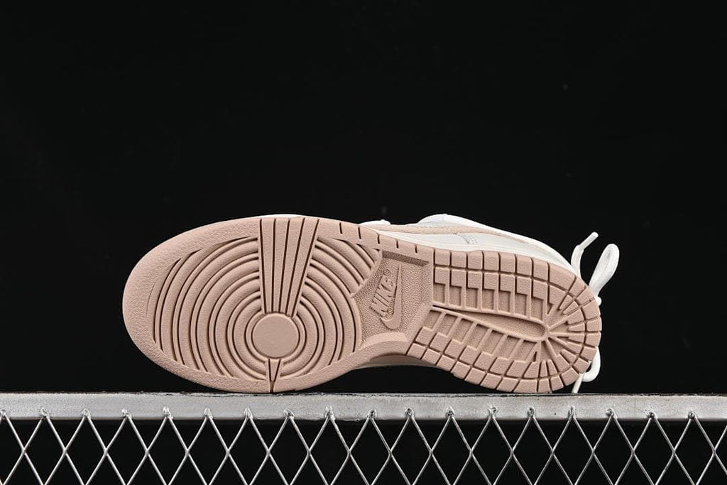 Nike SB Dunk Low Sneakers in White and Soft Pink