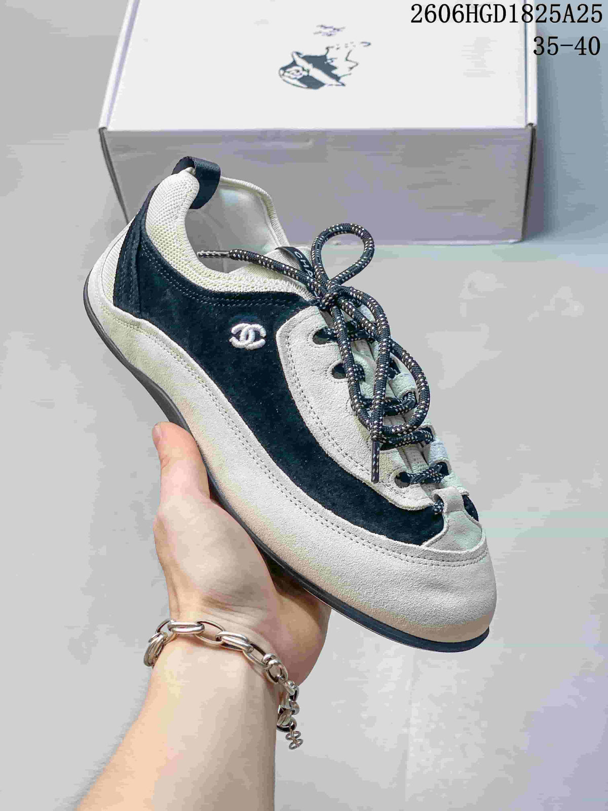 Chanel Two-Tone Low-Top Sneakers, Black and White, 2606HGD1825A25