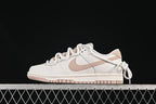 Nike SB Dunk Low Sneakers in White and Soft Pink