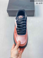 Nike Air Force 1 ’07 Low Sneakers in Coral and Black