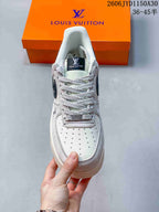 Low-Top Sneakers in White and Black with Monogram Details