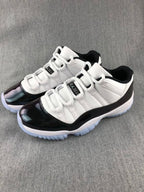 Jordan 11 Low Sneakers in White and Black