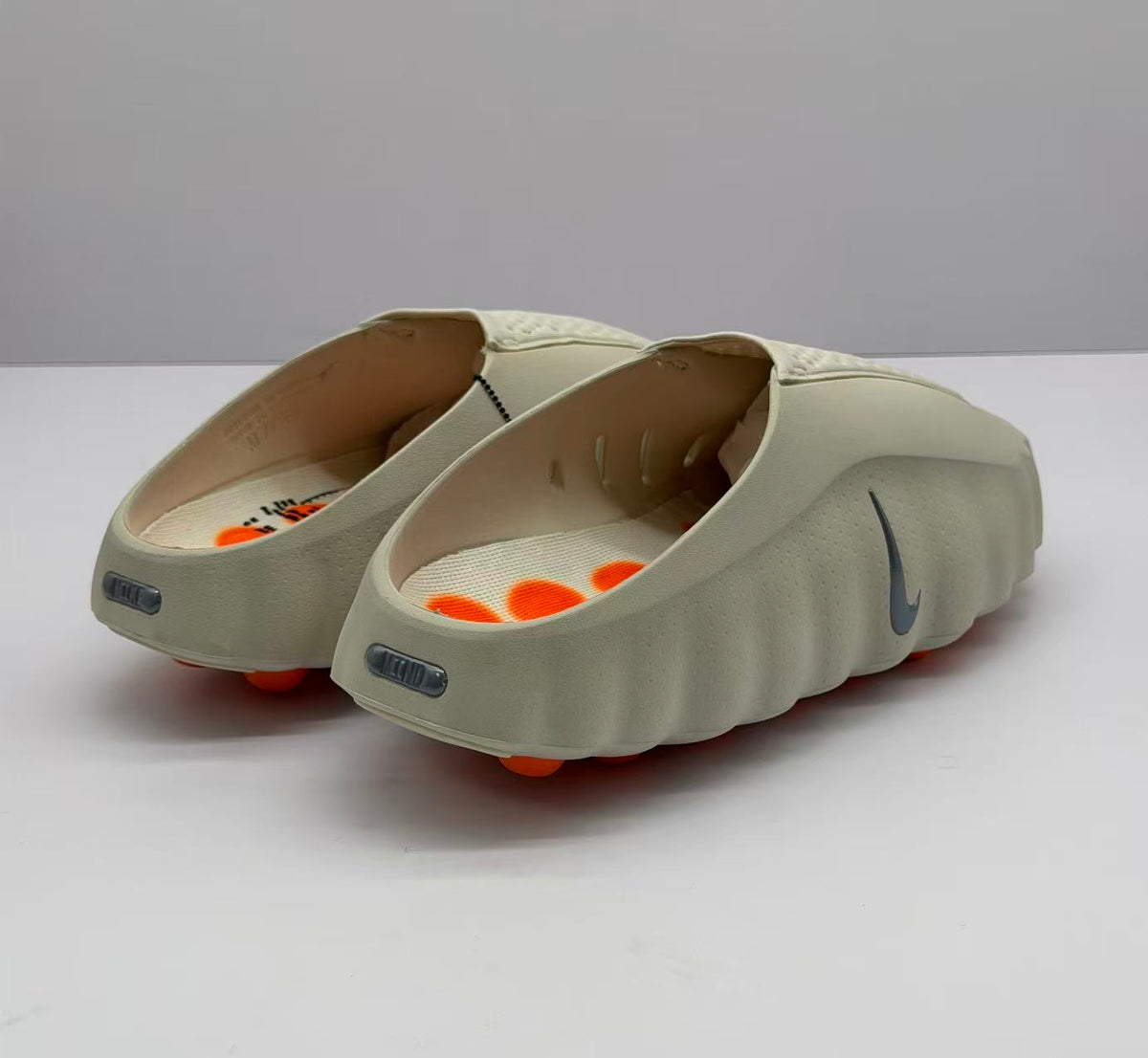 Nike Beige Slip-On Sandals with Orange Sole Details