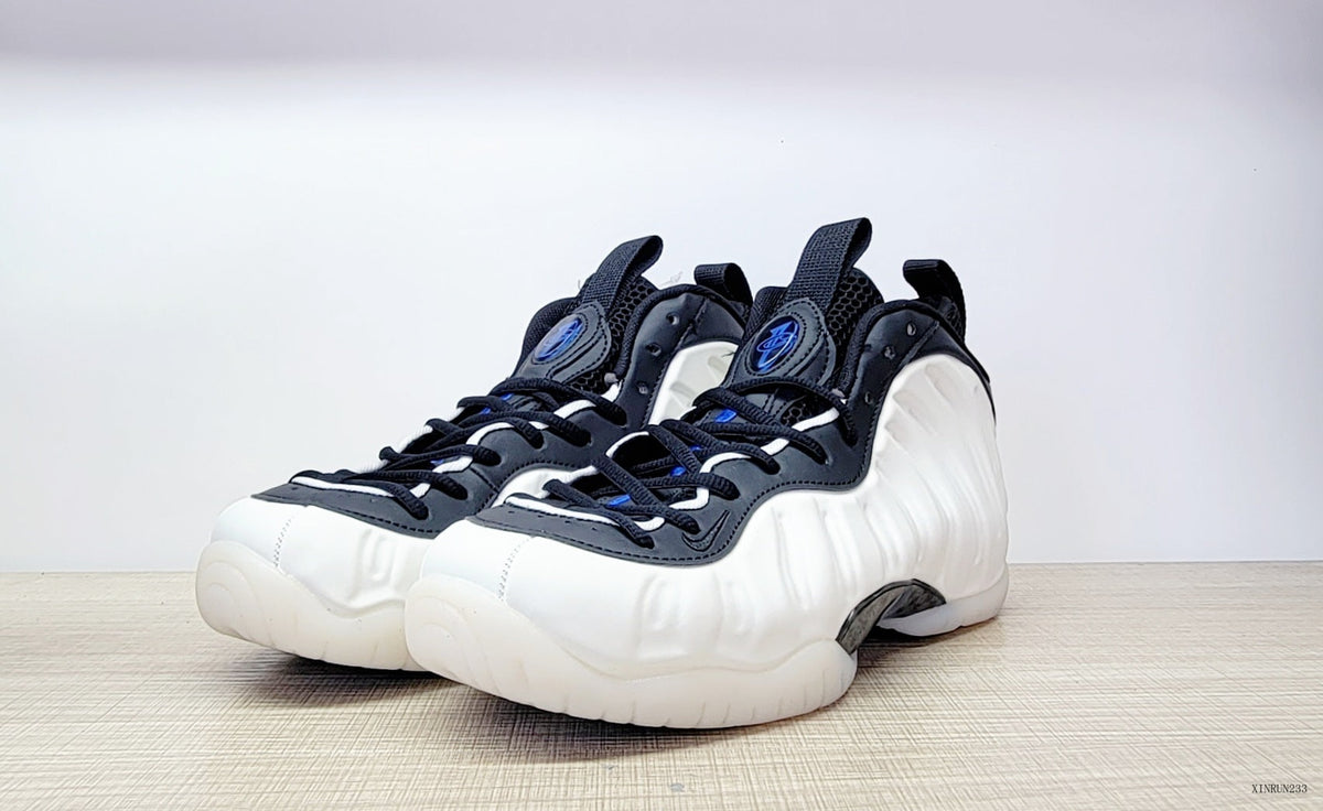 Nike Air Foamposite One High-Top Sneakers in Black, White and Blue