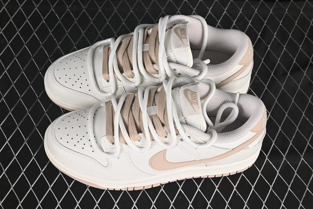 Nike SB Dunk Low Sneakers in White and Soft Pink