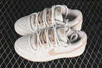 Nike SB Dunk Low Sneakers in White and Soft Pink