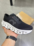 On Running Black and White Road Running Sneakers