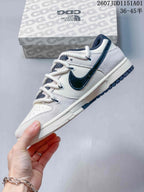 Nike SB Dunk Low x Carhartt White and Navy Sneakers