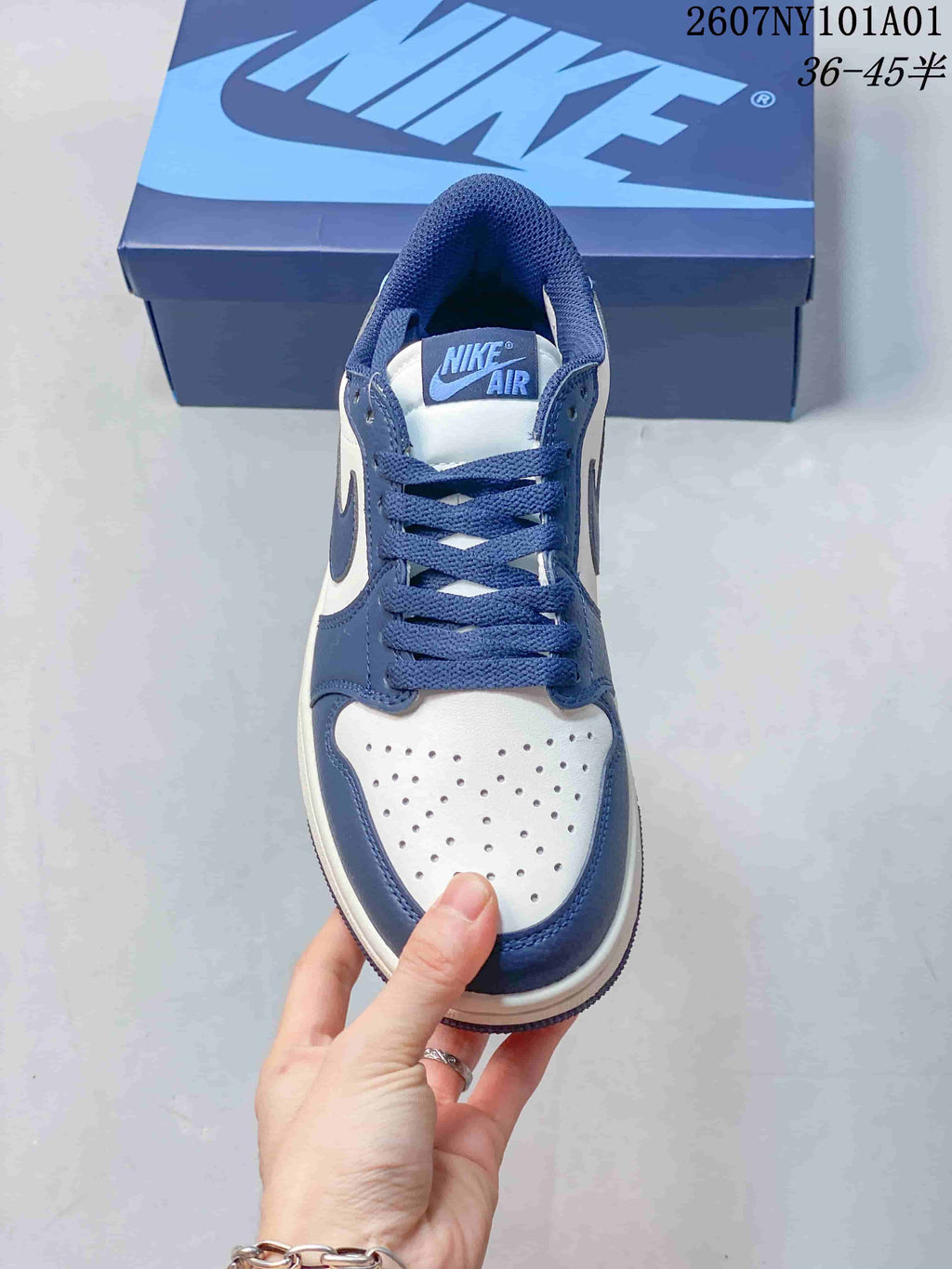 Nike Air Jordan 1 Low Sneakers in White and Blue