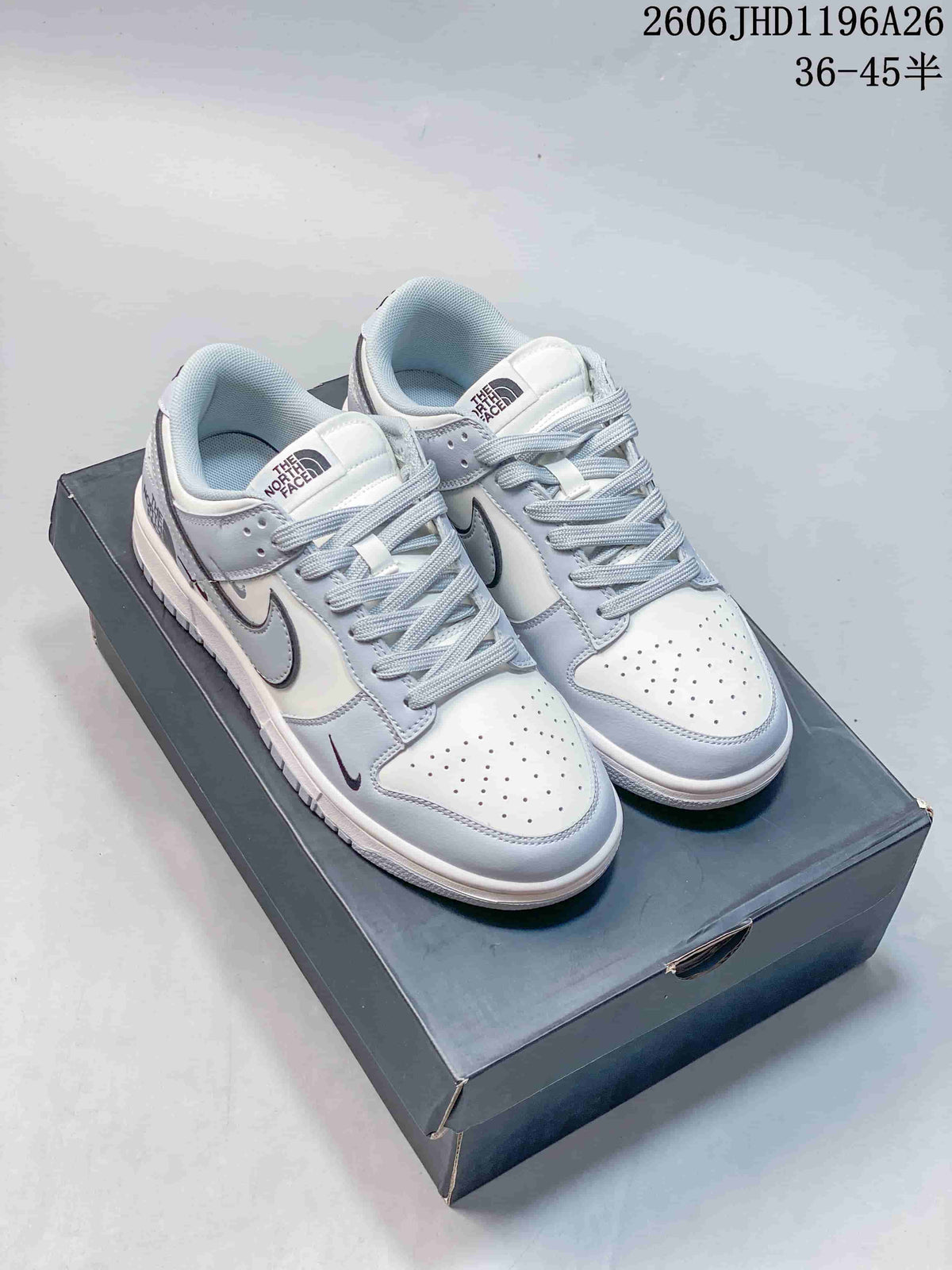 Nike SB Dunk Low Sneakers in White and Gray