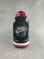Jordan 4 Retro Sneaker in Black, Red and White