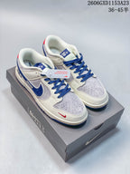 Nike SB Dunk Low Bearbrick-Inspired Cream and Blue Sneakers