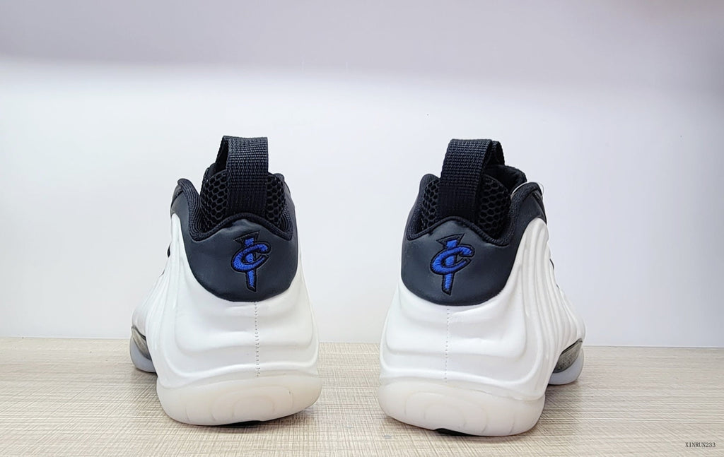 Nike Air Foamposite One High-Top Sneakers in Black, White and Blue