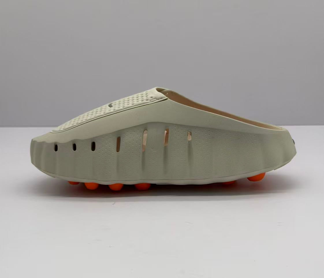 Nike Beige Slip-On Sandals with Orange Sole Details