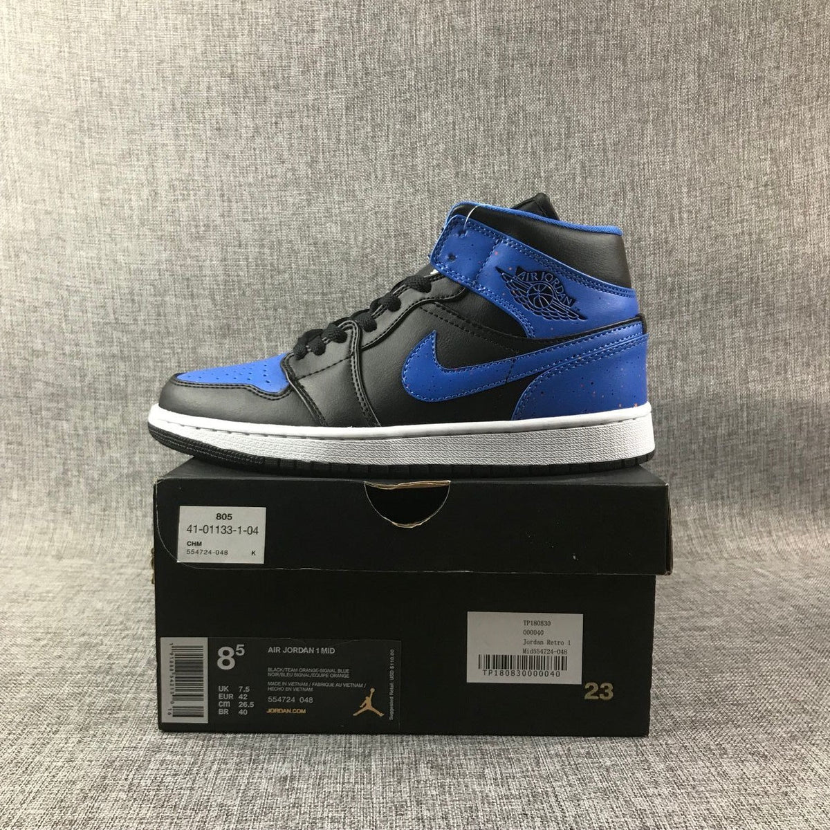 Air Jordan 1 Mid Black and Blue High-Top Sneakers