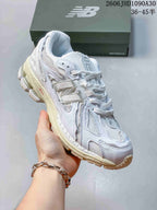 New Balance M1906R Sneakers in White and Silver