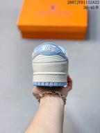 Nike Dunk Low Retro x IP Sneakers White and Light Blue